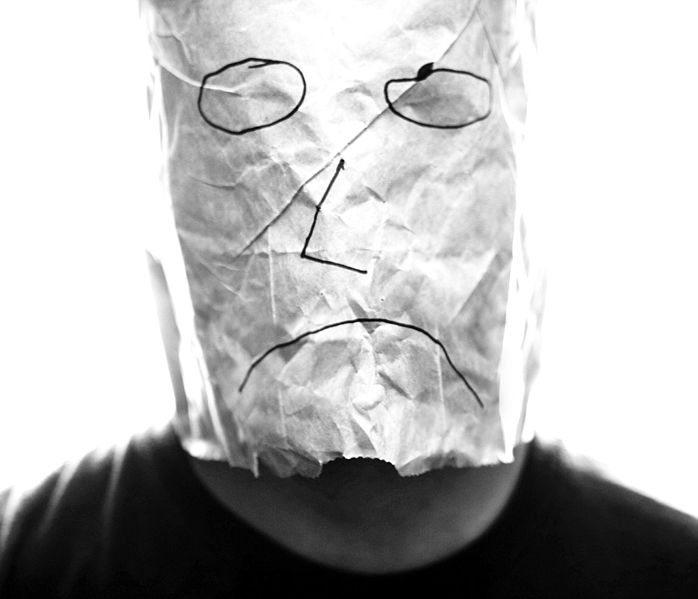 698px-Gray_paper_bag_with_sad_smiley_over_head